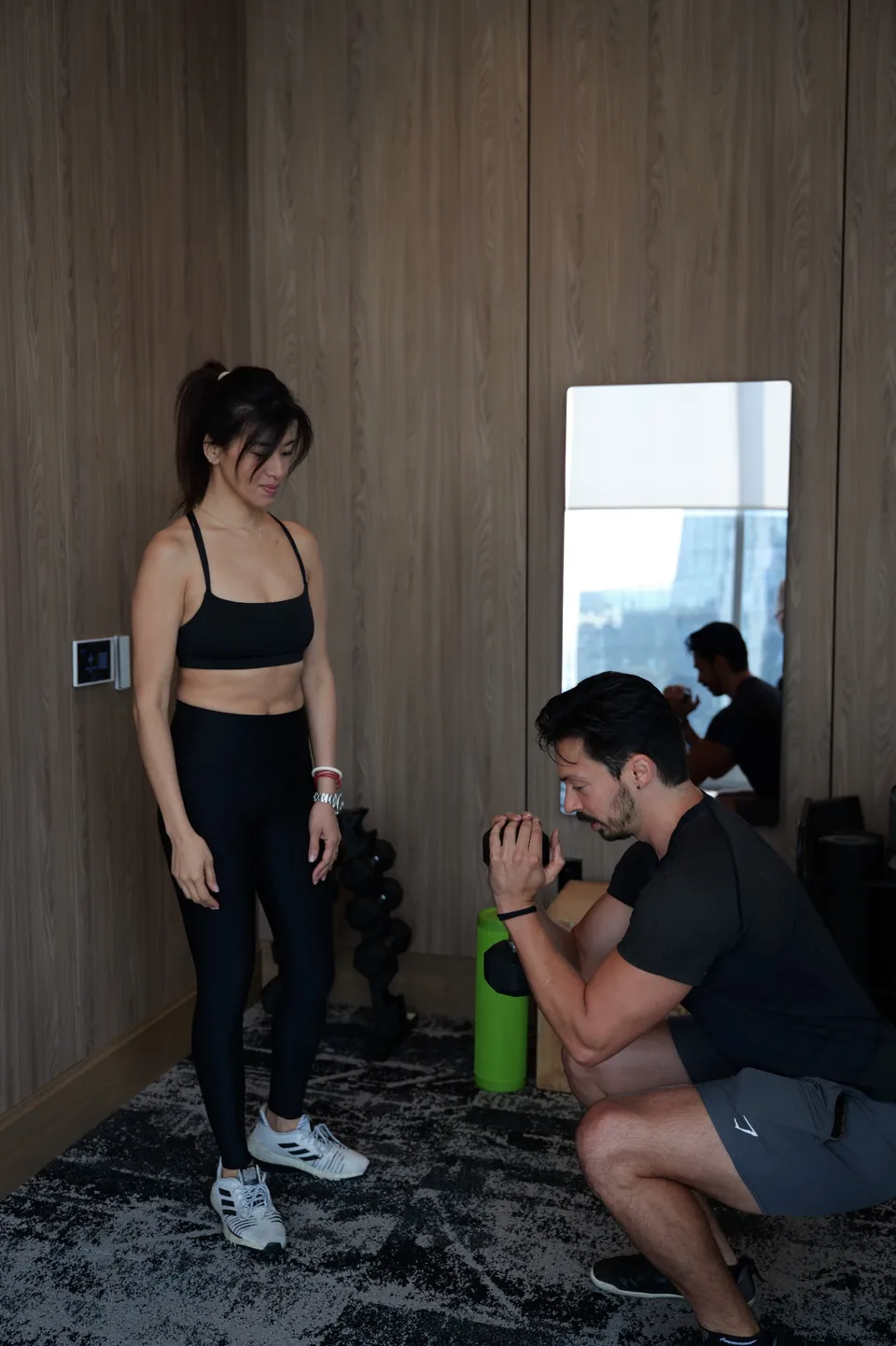 Joe demonstrating a controlled squat during a private movement coaching session.