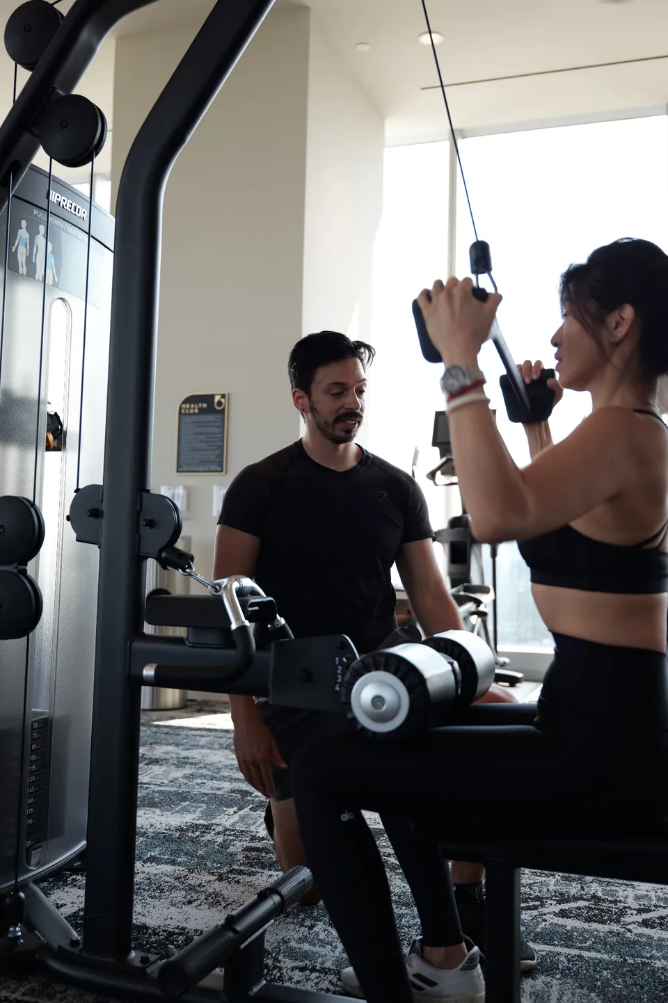 Joe observing exercise form during a private strength and performance session.