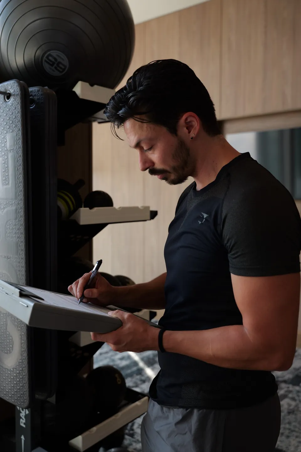 Joe recording notes while developing an individualized training program.